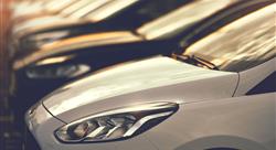 line of cars at auto dealership