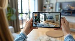 woman viewing a property using her phone